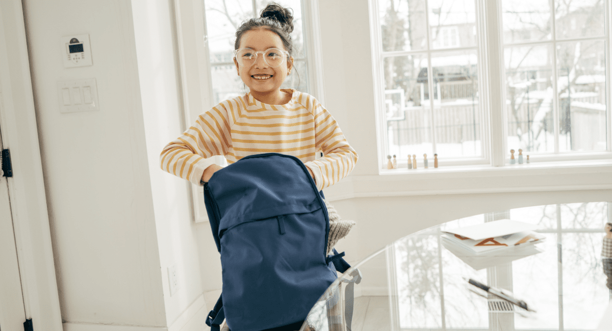 online student reaching into backpack