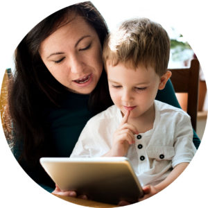 mother and son using tablet to learn at home