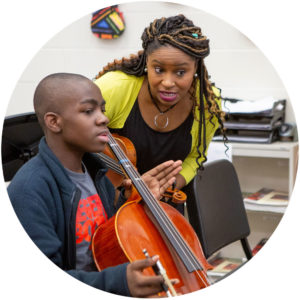 student gets cello instruction