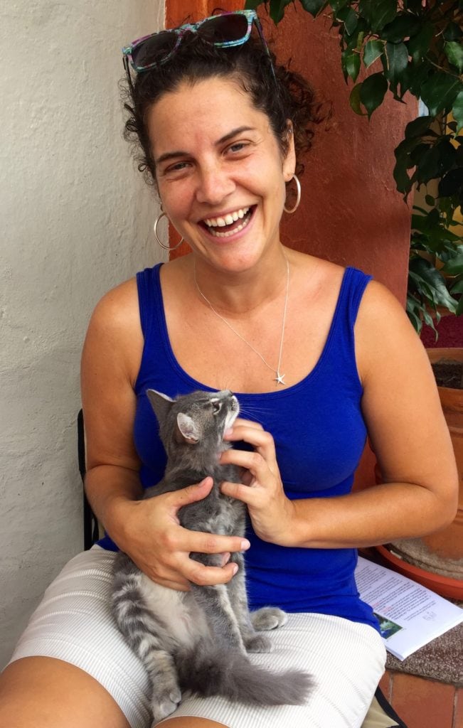 VLACS instructor poses with kitten in South America