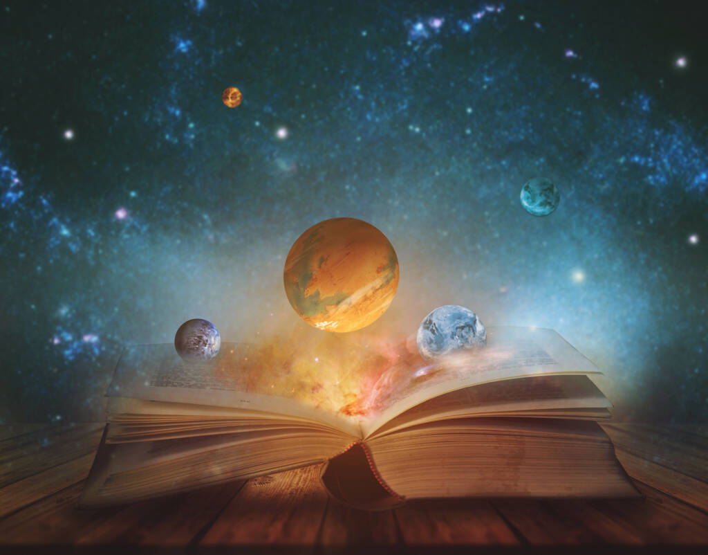 Book of the universe - opened magic book with planets and galaxies.