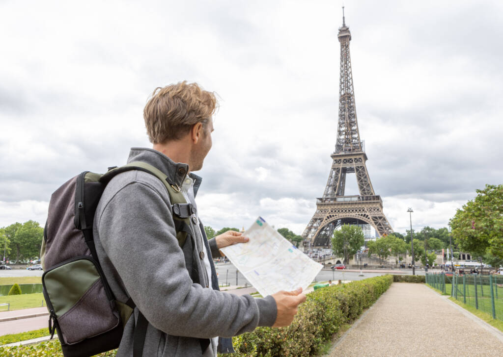 french student staring at Eiffel tower in paris