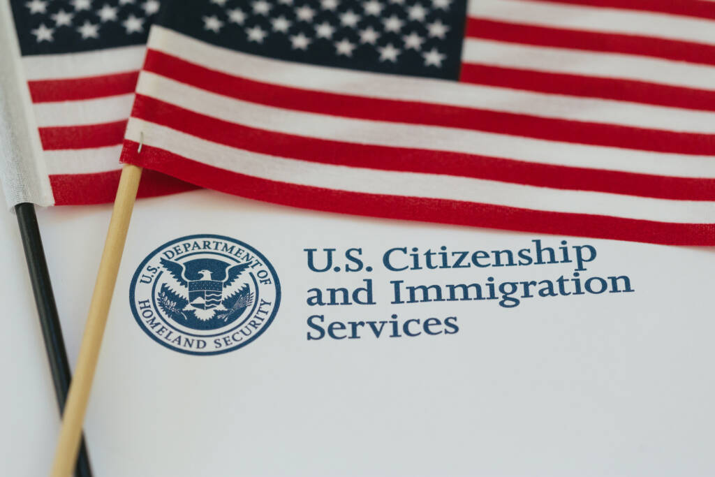 US flag and citizenship and immigration paperwork