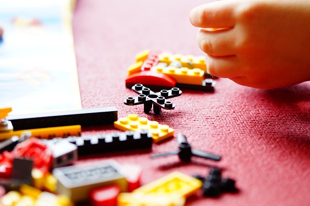 child playing with lego bricks