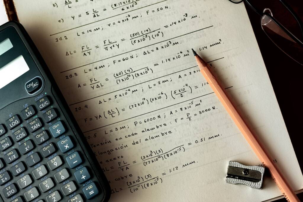 calculator and paper with math equations